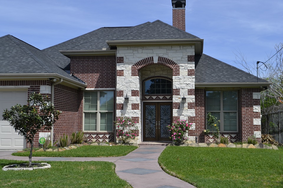 brick house with a clean landscape